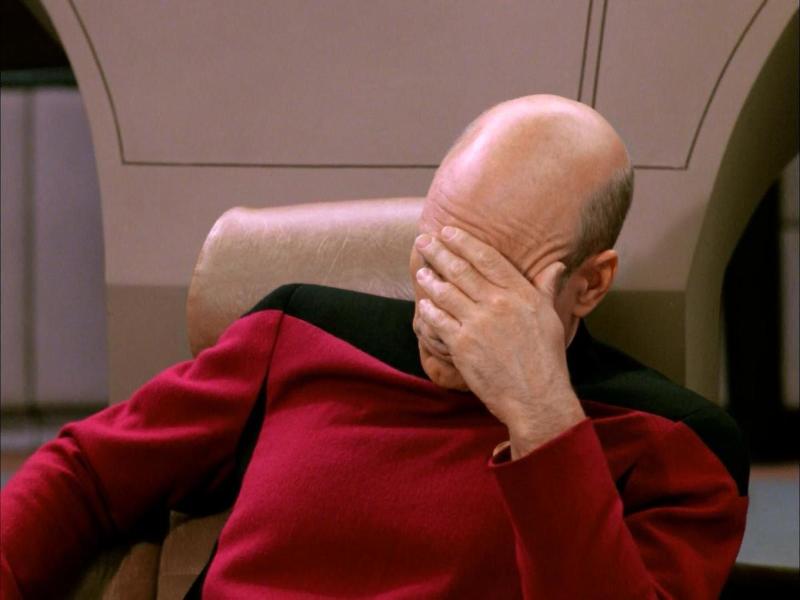Captain Picard from Star Trek in his famous facepalm pose.